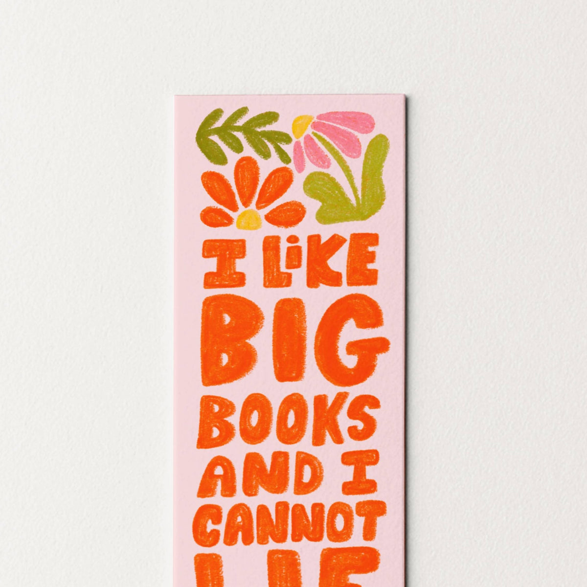 Colorful bookmark with floral designs and text on a light pink background