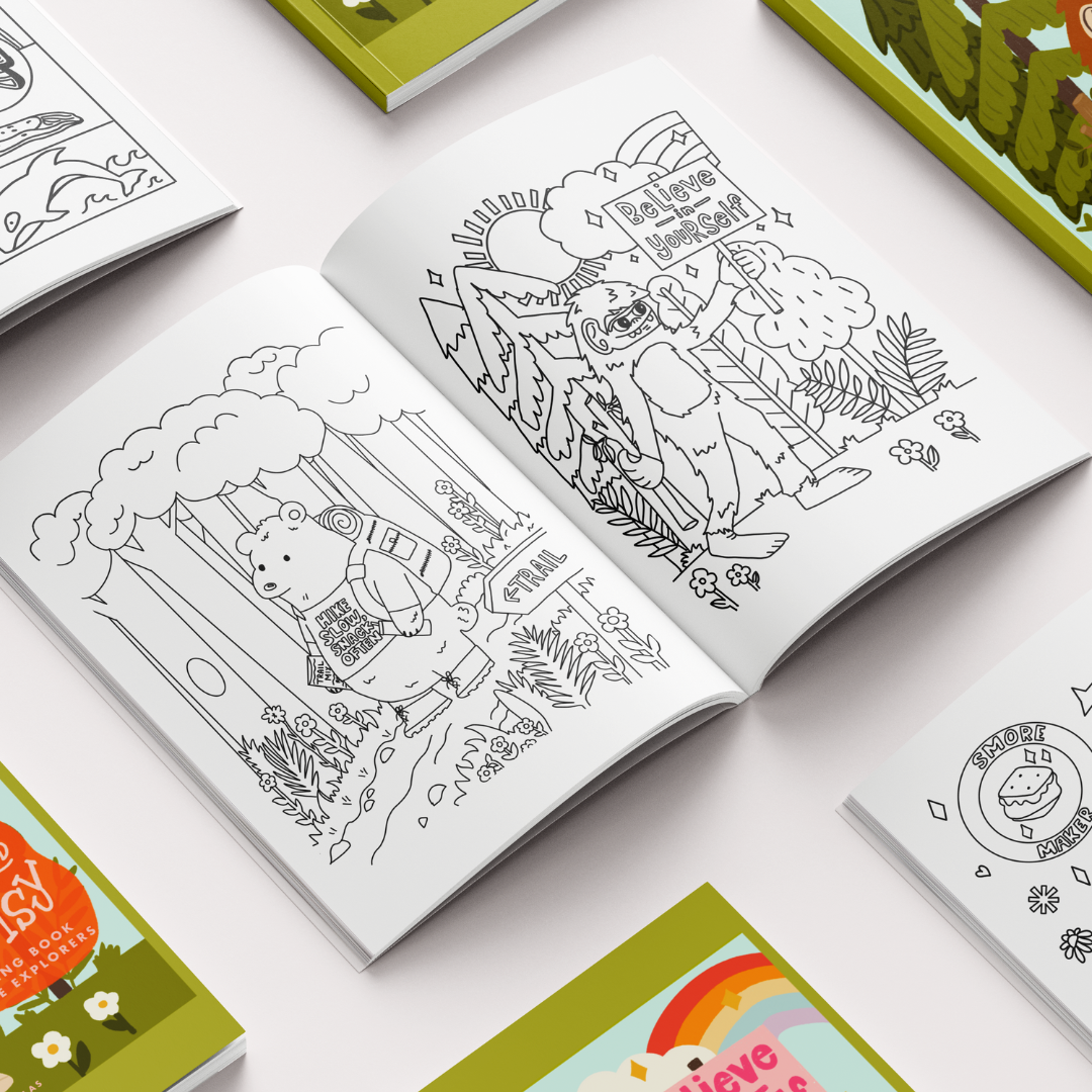 Coloring books with illustrations on a light surface