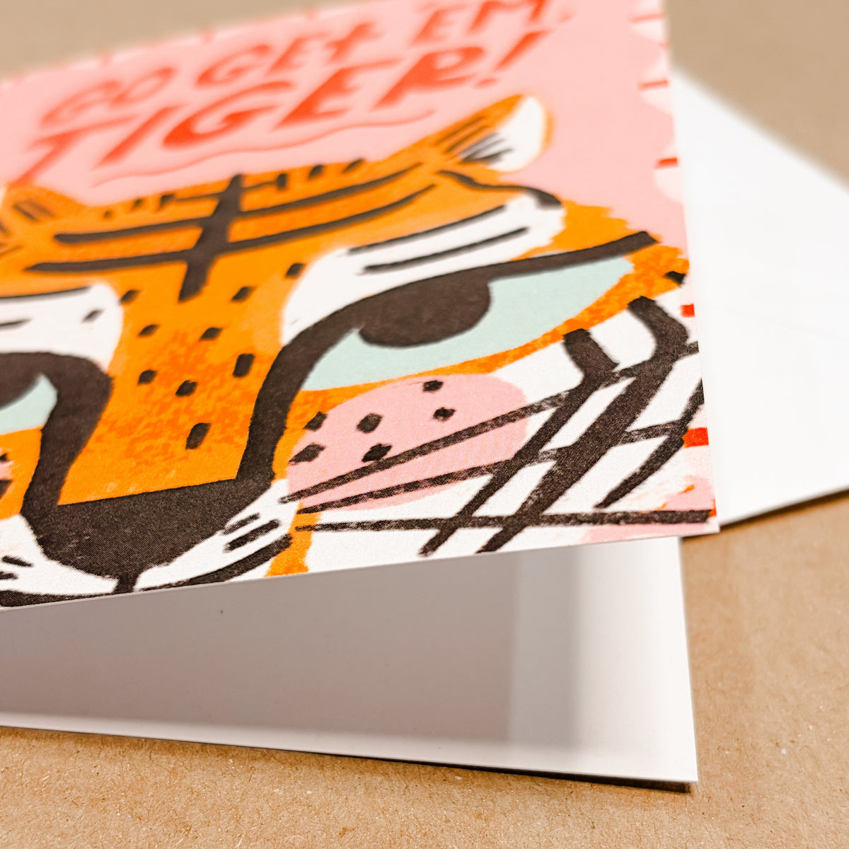 Greeting card with tiger illustration on a beige background