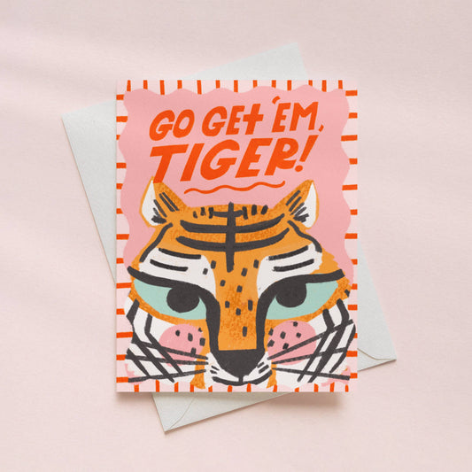 Greeting card with tiger illustration and 'Go Get 'em, Tiger!' text on a pink background