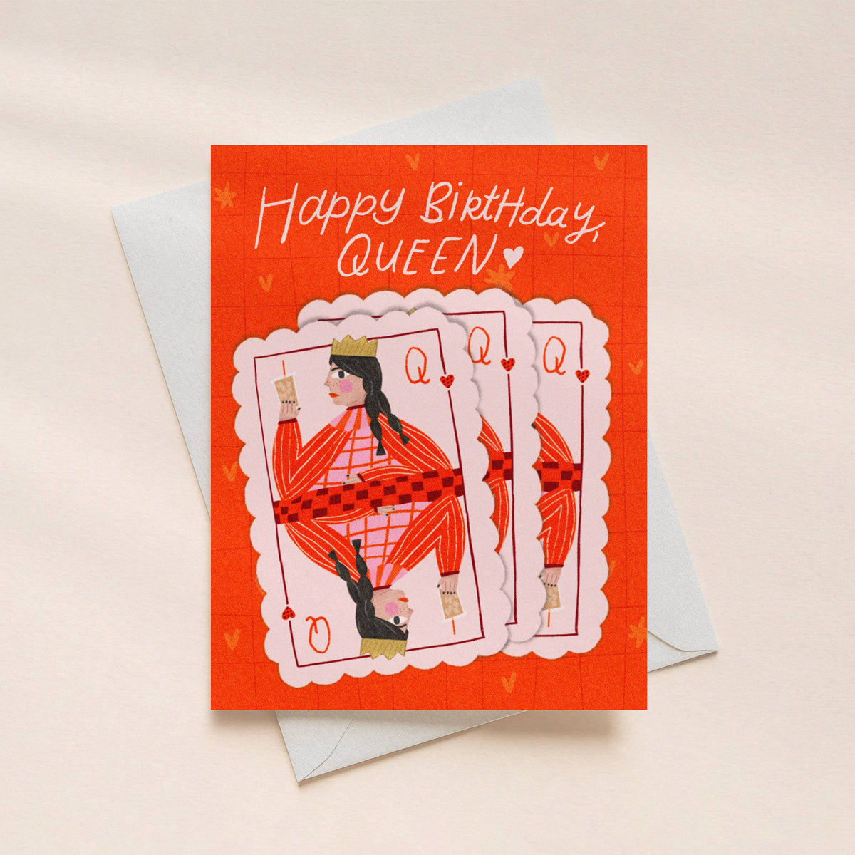 Birthday card with playing card design and 'Happy Birthday, Queen!' text on a beige background