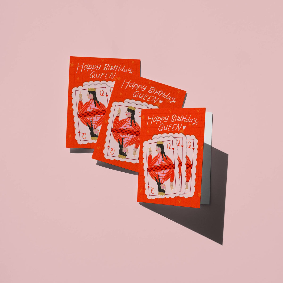 Three red birthday cards with a queen illustration on a pink background