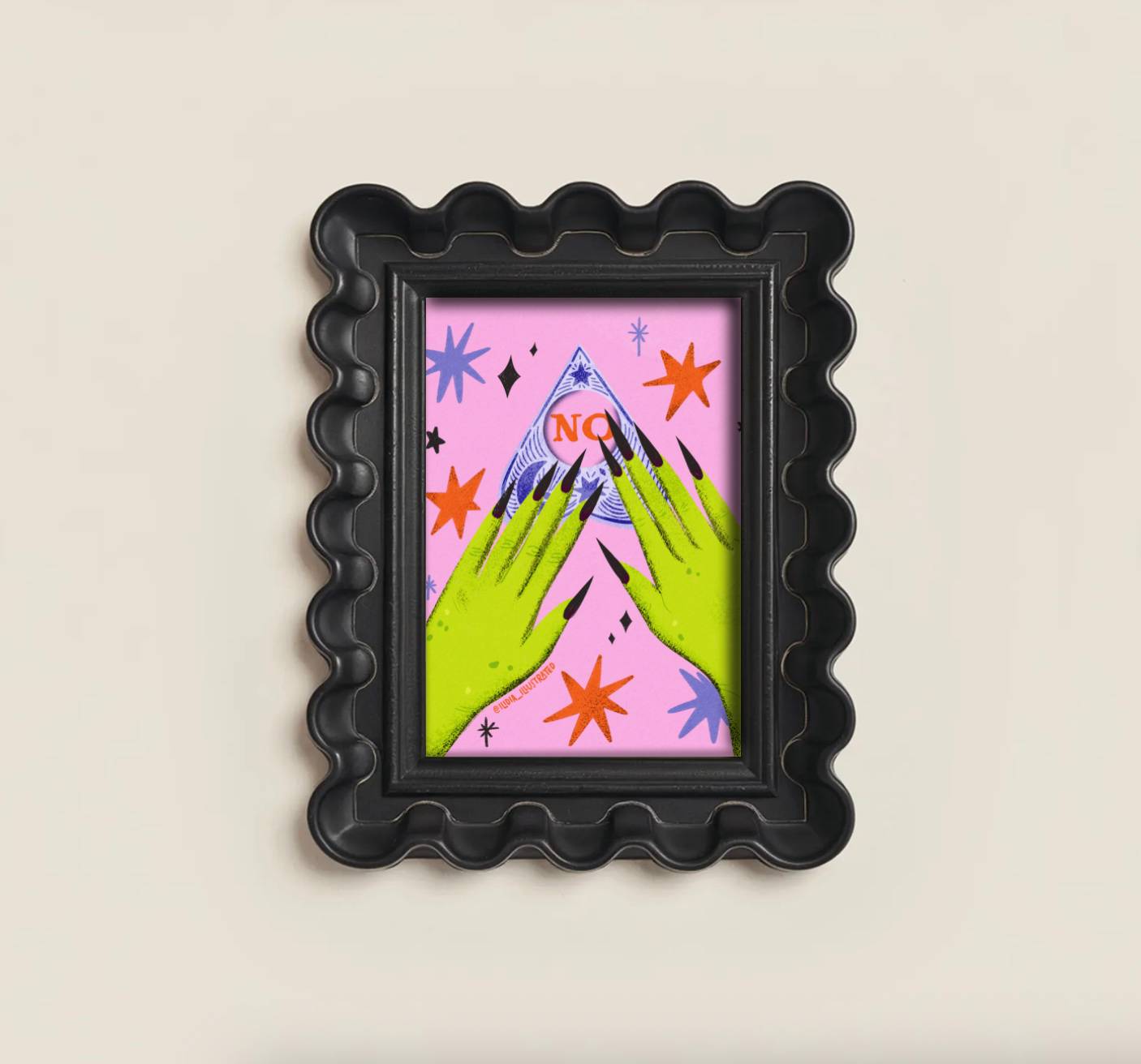 A black scalloped frame holding a colorful art print with two green hands pointing toward a blue mountain under a pink sky with orange stars and the word 'NO' in red.