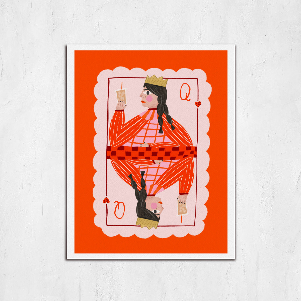 Framed artwork of a stylized card with a person on an orange background