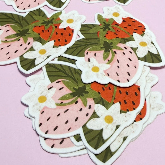 Strawberry-themed stickers with flowers on a pink background
