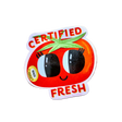 Certified Fresh tomato sticker on a wooden surface