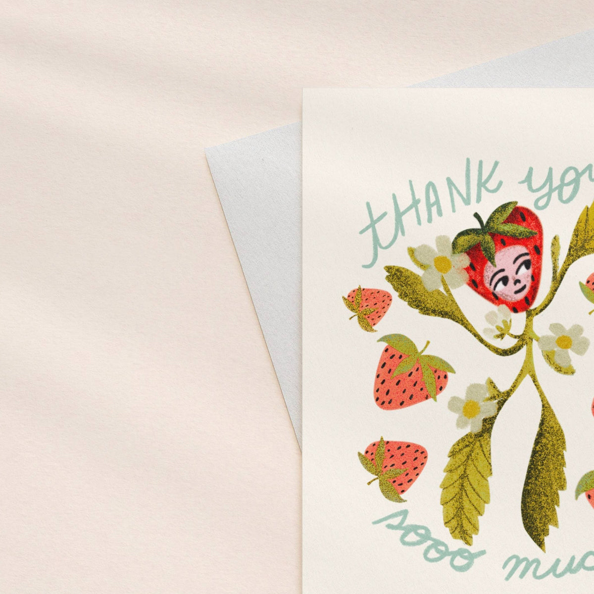 Greeting card with strawberry design and 'thank you so much' text on a light pink background