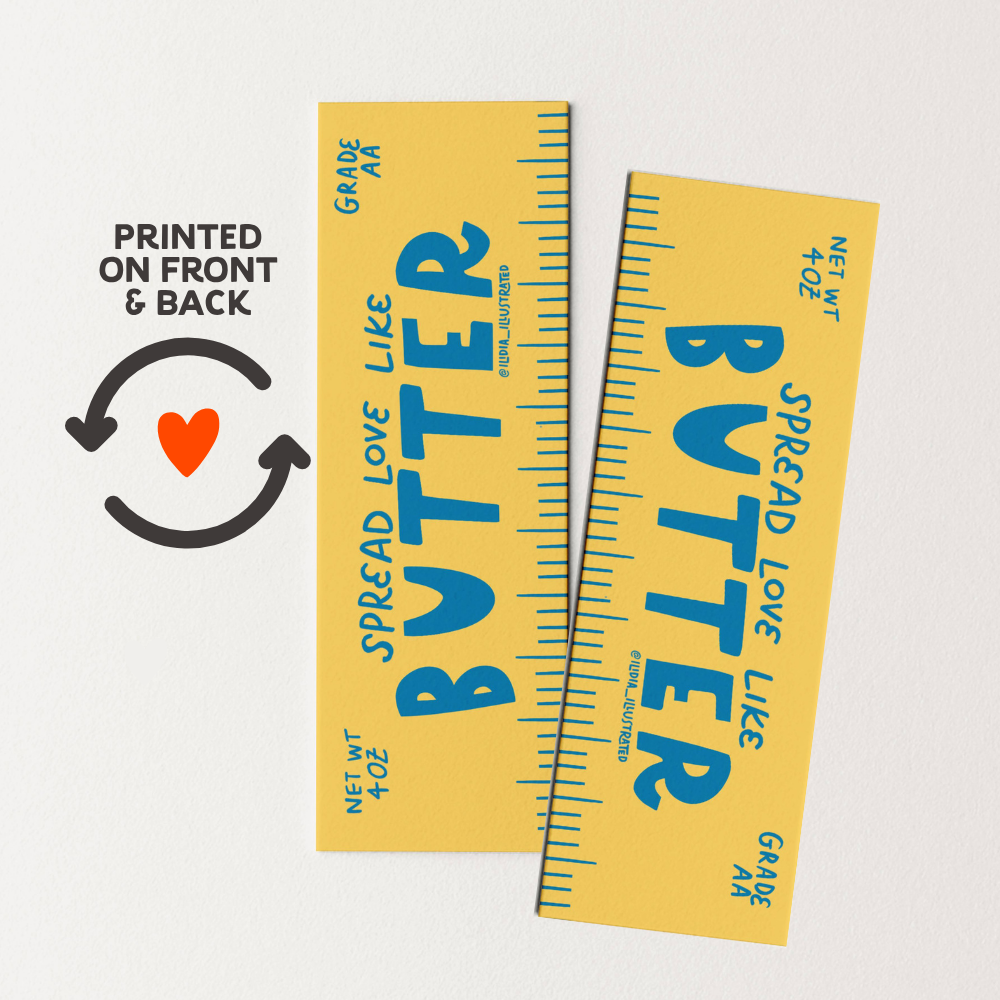 Two yellow butter packages with blue text on a white background